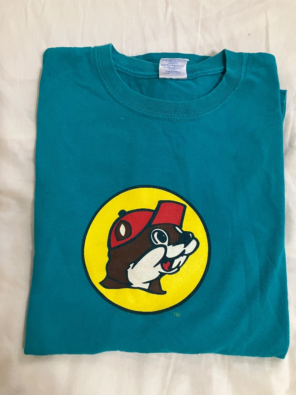 Buc E.     T shirt.   and stuffed animal